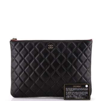 Chanel O Case Clutch Quilted Lambskin Medium
