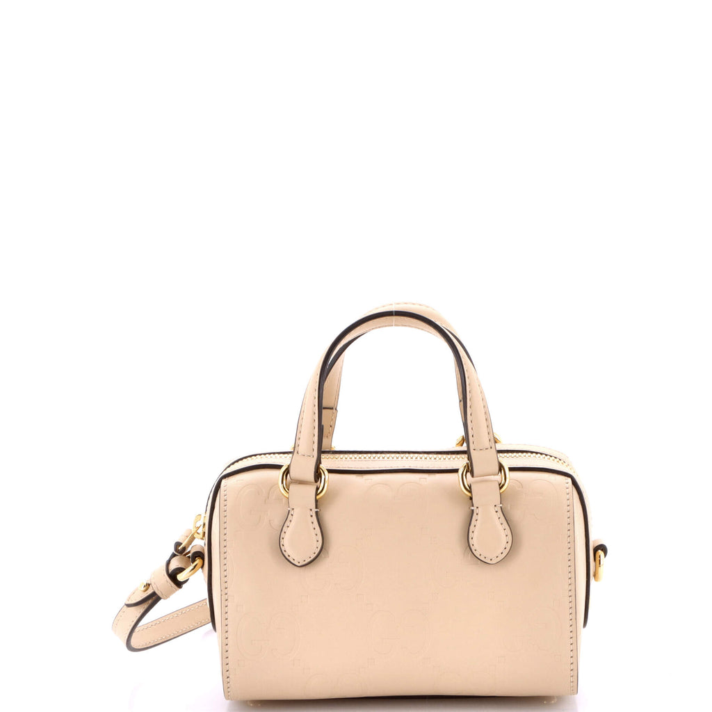 Gucci Convertible Top Handle Bag Jumbo GG Embossed Leather Mini