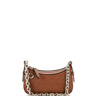 Gucci Emblem Half Moon Shoulder Bag GG Embossed Leather Mini