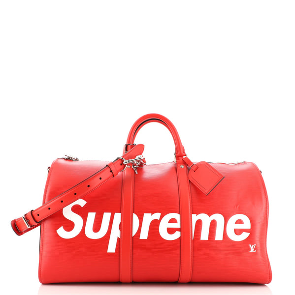 A LIMITED EDITION RED & WHITE EPI LEATHER KEEPALL BANDOULIÈRE 45 WITH  SILVER HARDWARE, LOUIS VUITTON X SUPREME, 2017