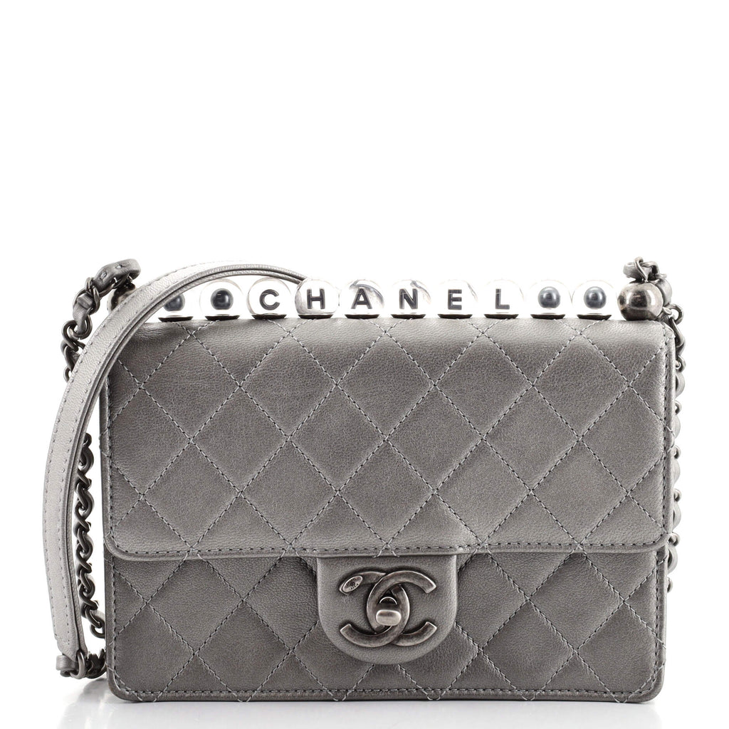 CHANEL  BLACK CHIC PEARLS SMALL FLAP BAG IN GOATSKIN LEATHER