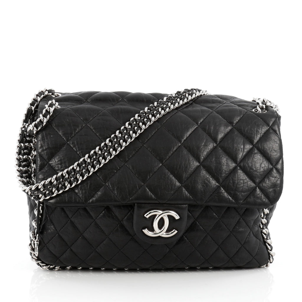 CHANEL CHAIN AROUND MESSENGER BAG black quilted leather with silver tone  hardware chain and leather strap and around the edges of the bag cream  fabric lining authenticity card original box 30cm x