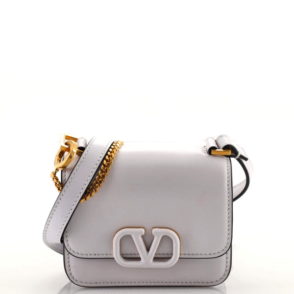 Shop Valentino Garavani VSling Micro Top Handle Bag