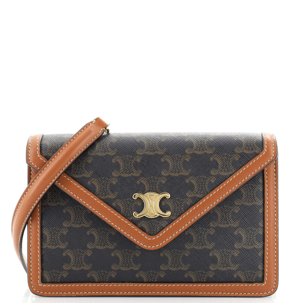 Shop CELINE Triomphe Canvas Clutch with chain in triomphe canvas