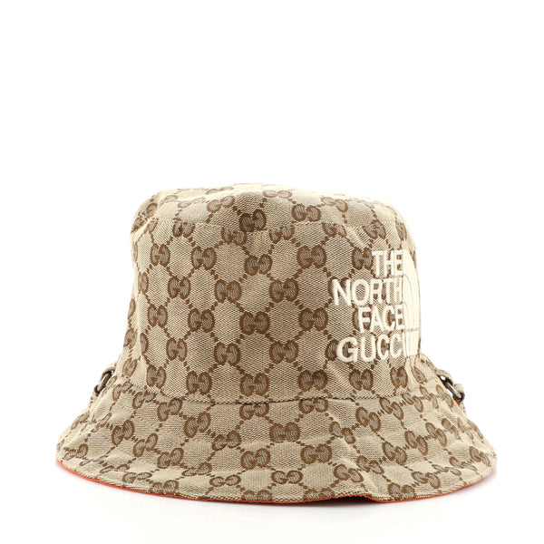 Shop the Reversible hat in GG canvas and nylon in brown at GUCCI