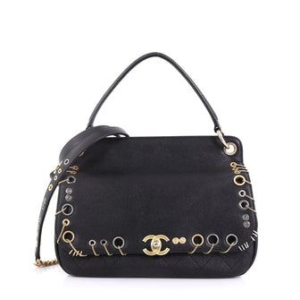 Chanel Model: Piercing Chic Flap Bag Grommet Embellished Caviar with Chain Detail Medium Black 40799/13