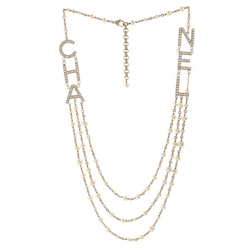 Chanel CHA-NEL Logo Triple Strand Necklace Crystal Embellished Metal and Faux Pearls