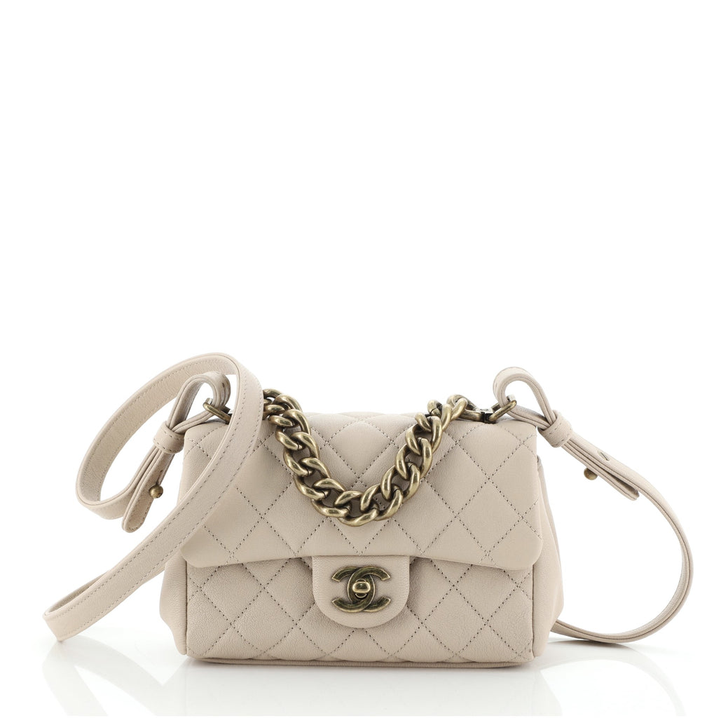 CHANEL Sheepskin Quilted Mini Trapezio Flap Handbag