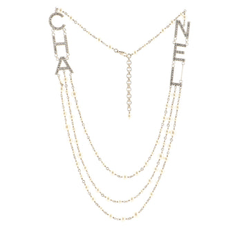 Chanel CHA-NEL Logo Triple Strand Necklace Crystal Embellished Metal and Faux Pearls