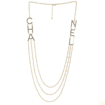 Chanel CHA-NEL Logo Triple Strand Necklace Crystal Embellished Metal and Faux Pearls